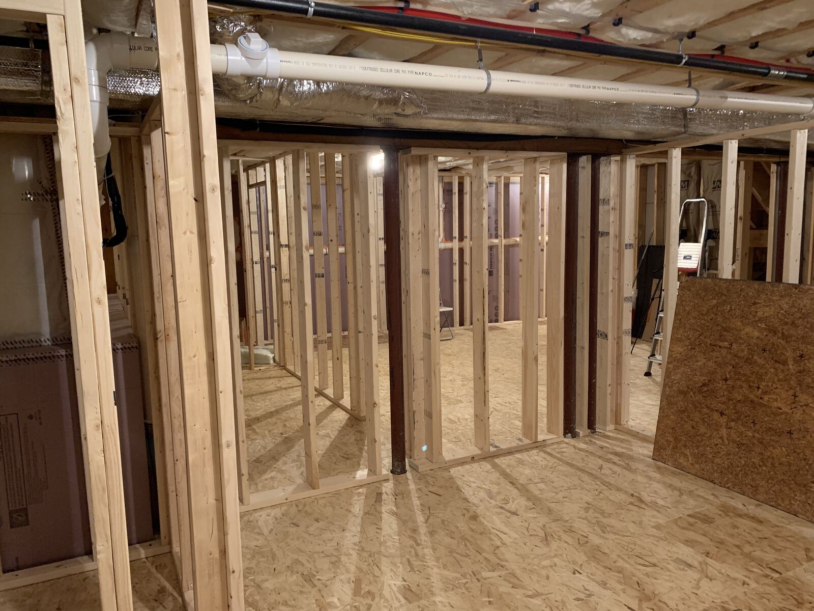 Open stud framing before the storage wall was installed